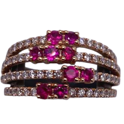 Fourteen Karat rose gold ring with rubies and diamond ring 